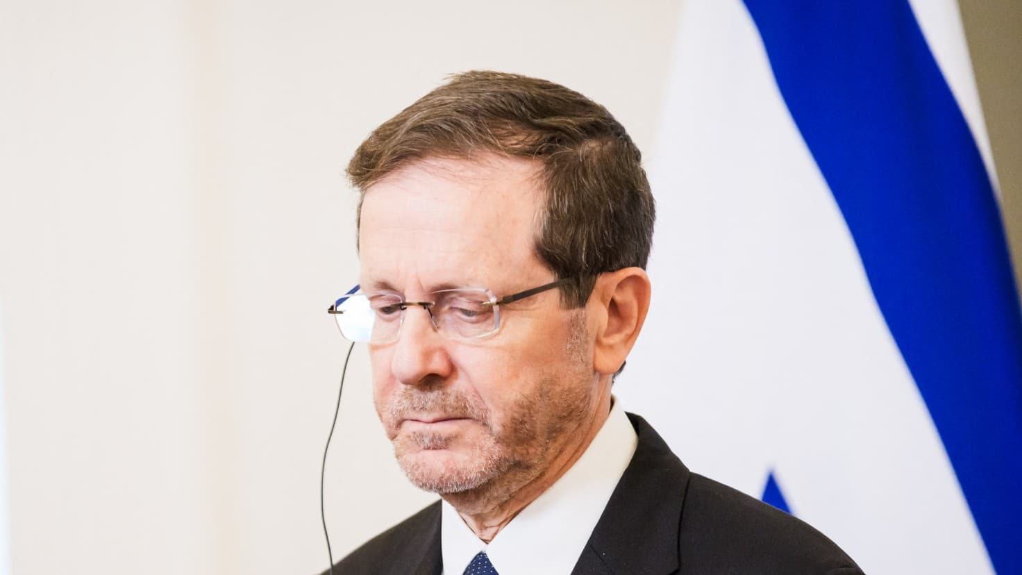 Herzog's UK visit should lead straight to The Hague